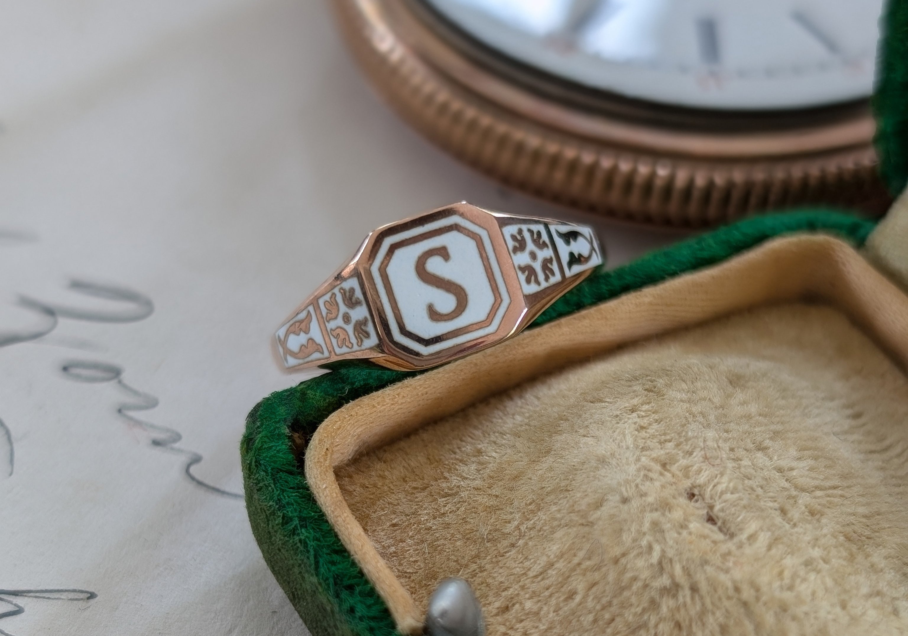 Gold ring with white enamel