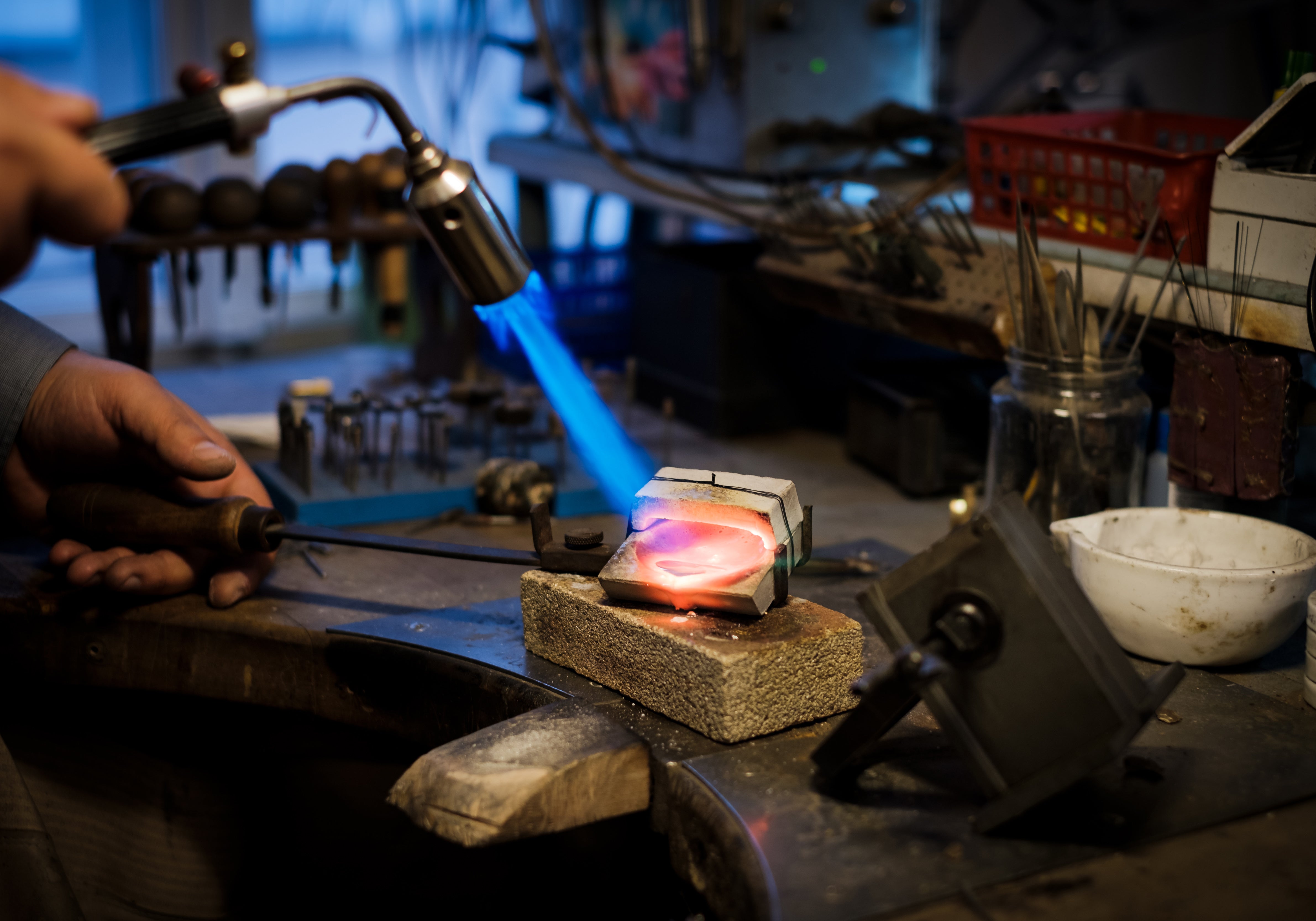 BENCH JEWELER MELTING GOLD TO CAST RING